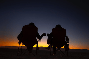 KapiK1 Expedition Co | Image of Co-Founders Ray Zahab and Stefano Gregoretti enjoying coffee after a long day exploring the desert.